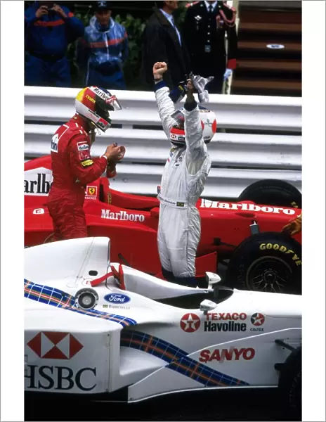 Formula One World Championship: Michael Schumacher, Ferrari F310B 1st place with Rubens Barrichello, Stewart SF-1 2nd place in Parc-Ferme