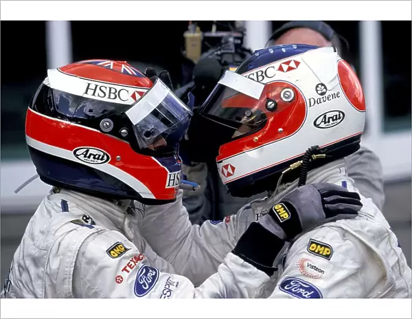 Formula One World Championship: Rubens Barrichello celebrates with Johnny Herbert in Parc Ferme