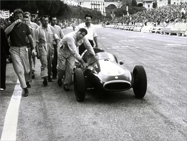 1957 Monaco Grand Prix: Jack Brabham pushes his Coper across the finish line