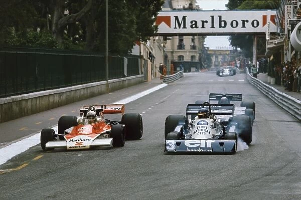 1977 Monaco Grand Prix - Jochen Mass and Ronnie Peterson: Jochen Mass overtakes Ronnie Peterson with Mario Andretti in pursuit