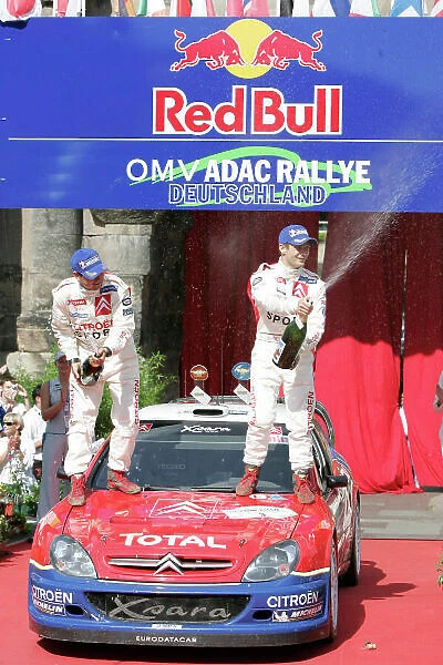 2004 FIA World Rally Champs. Round ten, OMV Deutschland Rally. 19th - 22nd August 2004. Sebastien Loeb, Citroen, podium. World Copyright: McKlein / LAT