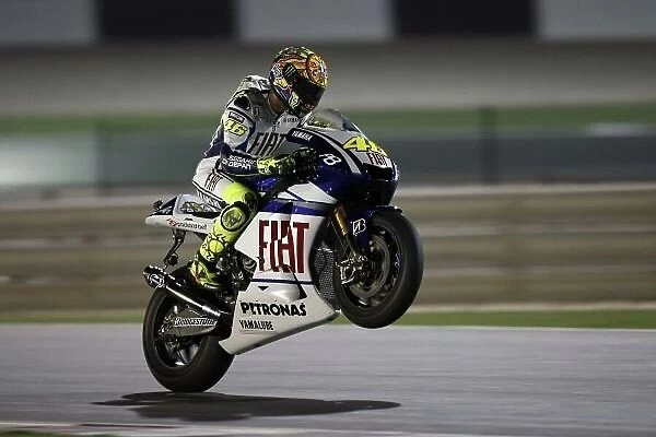 MotoGP. Valentino Rossi (ITA), FIAT Yamaha Team, pulls a wheelie.