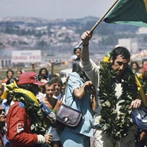 1975 Brazilian Grand Prix - Podium: Carlos Pace 1st position, celebrates winning his home Grand Prix, taking his maiden and only win. Emerson Fittipaldi