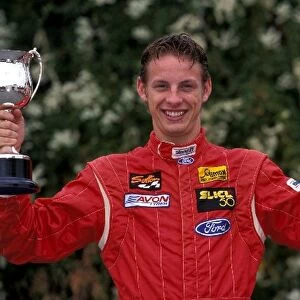 Jenson Button Photo Shoot: Formula Ford driver Jenson Button with a trophy and champagne