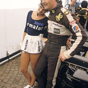 Zandvoort, Holland. 24-26 August 1984: Nigel Mansell 3rd position, with a Nelson Piquet, sponsored grid girl, portrait