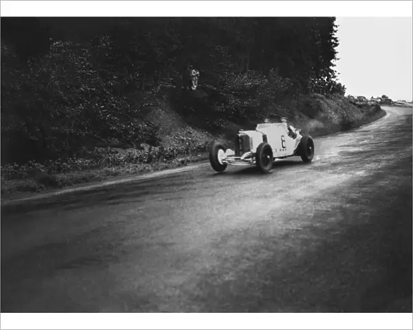 1931 German Grand Prix: Rudolf Caracciola and his mechanic, Wilhelm Sebastian, 1st position, action