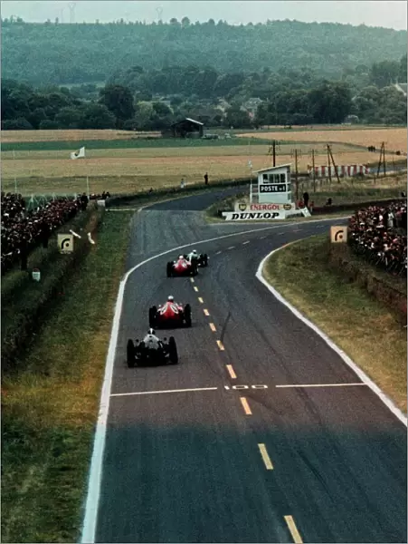 Formula One World Championship: Eventual race winner Jack Brabham Cooper Climax T53 leads Phil Hill Ferrari D246 and Wolfgang von Trips Ferrari D246