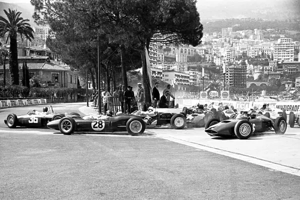 Formula One World Championship: Ritchie Ginther leads from Jim Clark Lotus 21 and winner Stirling Moss, Lotus 18