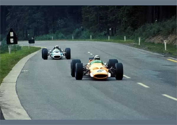 Formula One World Championship: Denny Hulme McLaren Cosworth M7A, leads Jackie Stewart Matra Cosworth MS10