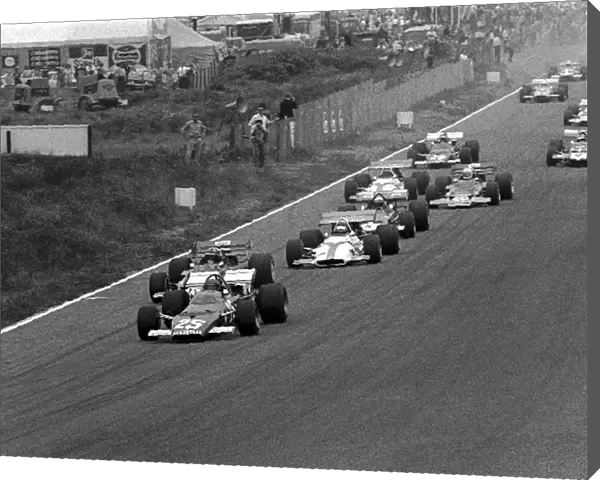 Formula One World Championship: The start, Jacky Ickx Ferrari 312B gets away ahead of Jochen RindtLotus 72C and Jackie Oliver BRM P153