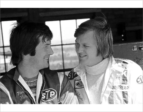 Formula One World Championship: March designer Robin Herd left, enjoys a joke with Ronnie Peterson