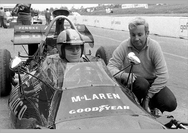 Formula One World Championship: Mark Donohue Mclaren M19A, 3rd place on his Grand Prix debut here with Mclaren Boss Teddy Mayer, right
