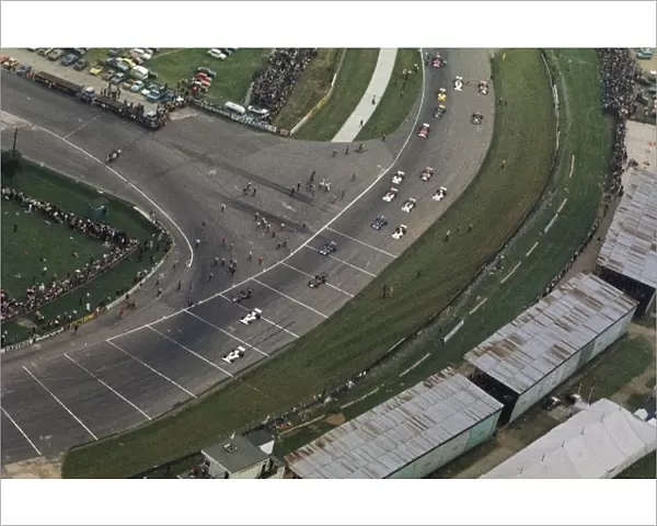 Formula One World Championship: An aerial view of the field heading around Woodcote and taking their grid positions for the start of the race