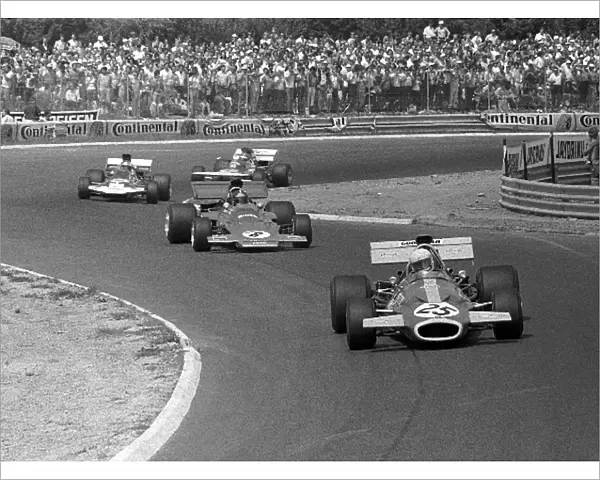 Formula One World Championship: Tim Schenken Brabham BT33, 6th place scores his first championship point, leads Emerson Fittipaldi Lotus 72D