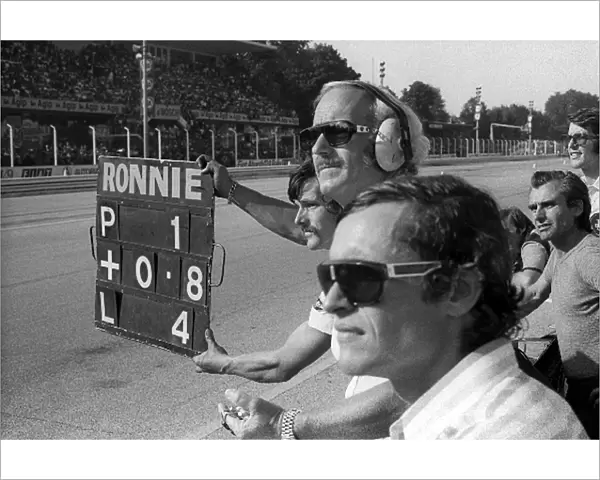 Formula One World Championship: Jacky Ickx Lotus, who retired from the race on lap 31 with a broken throttle linkage, watches with Colin Chapman
