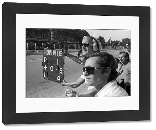 Formula One World Championship: Jacky Ickx Lotus, who retired from the race on lap 31 with a broken throttle linkage, watches with Colin Chapman