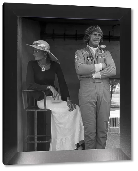 Formula One World Championship: James Hunt Hesketh, who retired from the race on lap 3 with a blown engine, with his girlfriend Suzy Miller
