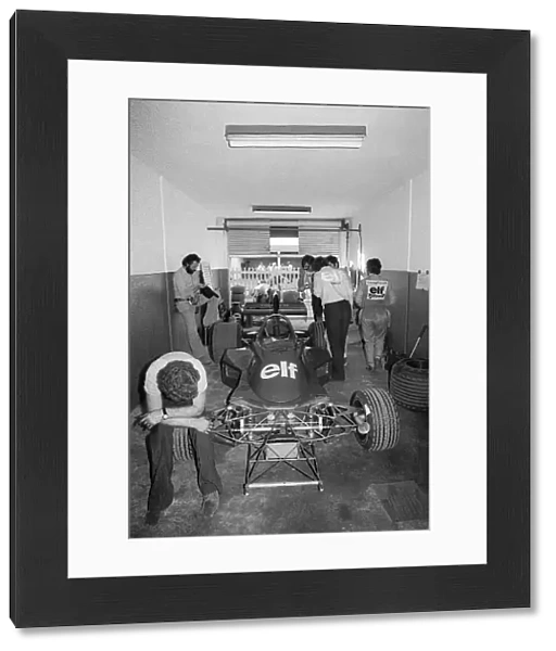 Formula One World Championship: Fifth placed Patrick Depailler walks from his Tyrrell 007 in the garage