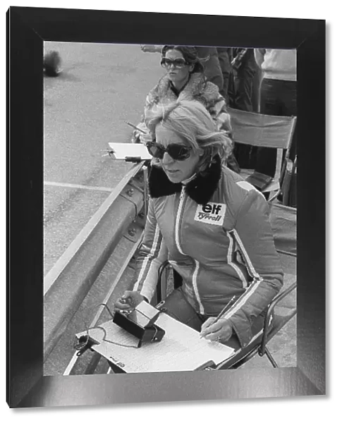 Formula One World Championship: Norah Tyrrell, wife of Ken Tyrrell Tyrrell Team Owner, performs lap timing duties from the pit wall