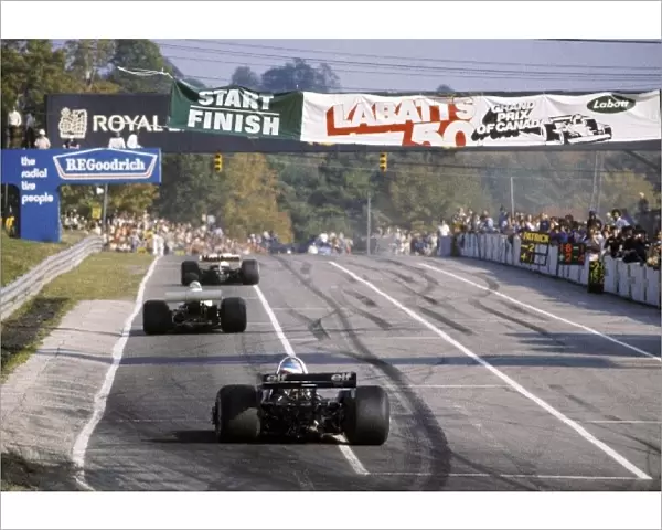 Formula One World Championship: Race winner James Hunt McLaren M23 leads ninth placed Ronnie Peterson March 761 and second placed Patrick Depailler