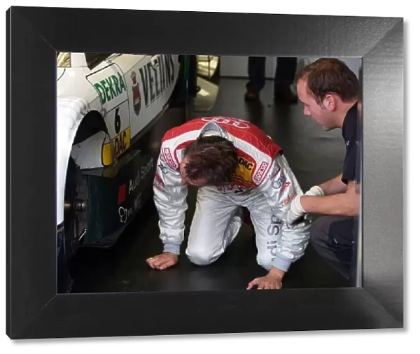 DTM. Heinz-Harald Frentzen (GER) examines the brakes of his Audi Sport