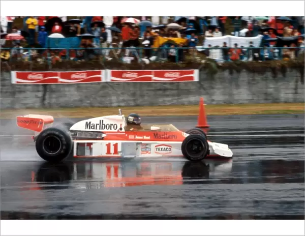 Formula One World Championship: James Hunt McLaren M23 overcame the terrible race conditions and a puncture late in the race to take third position