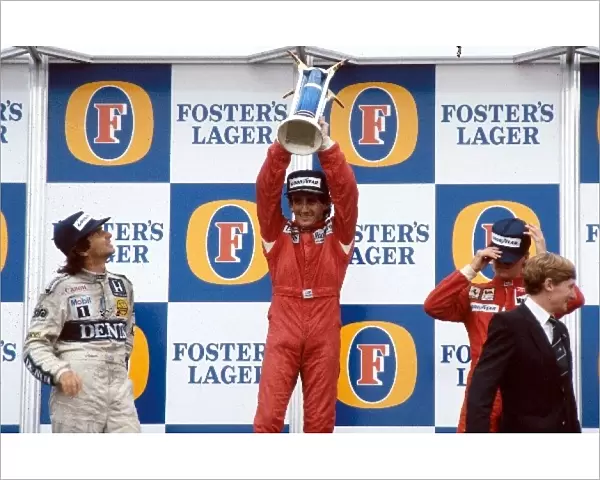Formula One World Championship: World Champion Alain Prost with Nelson Piquet, left, and Stefan Johansson, right