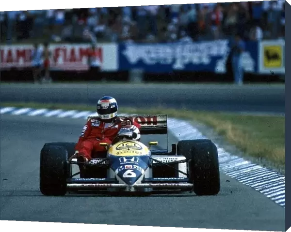 Formula One World Championship: Winner Nelson Piquet Williams FW11, gives Keke Rosberg McLaren a lift back to the pits