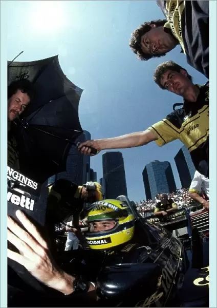 Formula One World Championship: Pole sitter and race winner Ayrton Senna Lotus 98T studies the timing monitors during qualifying
