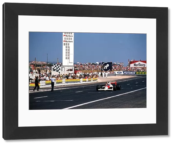 Formula One World Championship: Race winner Alain Prost McLaren MP4  /  5 takes the chequered flag