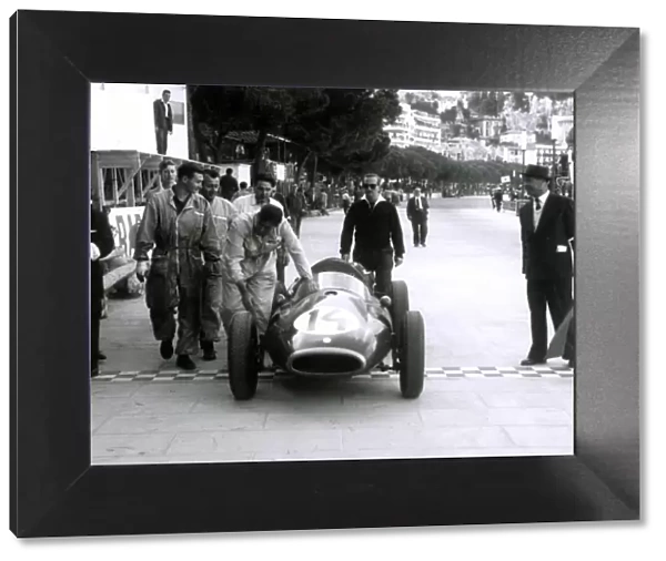 1957 Monaco Grand Prix Monaco, Monte Carlo. 1957 Jack Brabham pushes his Coper across