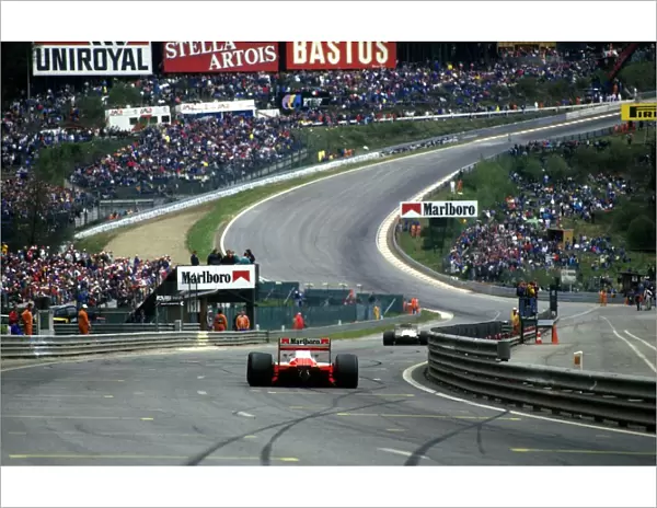 Formula One World Championship: Winner Alain Prost Mclaren MP4-3 approaches Eau Rouge