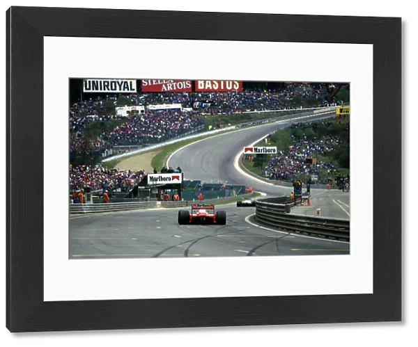 Formula One World Championship: Winner Alain Prost Mclaren MP4-3 approaches Eau Rouge