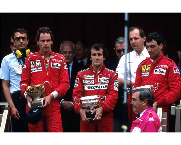 Formula 1 World Championship: Winner Alain Prost McLaren MP4  /  4, with 2nd placed Gerhard Berger Ferrari F187 and 3rd placed Michele Alboreto Ferrari
