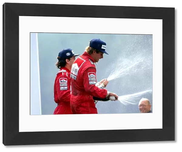 Formula One World Championship: L-R: Race winner Ayrton Senna McLaren, sprays champagne with third placed Gerhard Berger McLaren