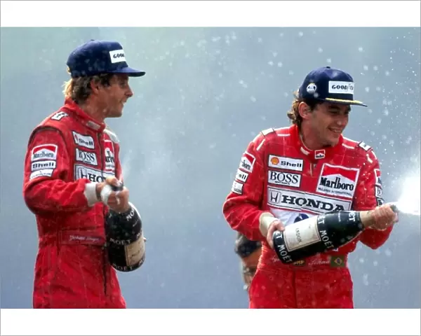 Formula One World Championship: R-L: Race winner Ayrton Senna McLaren, sprays champagne with third placed Gerhard Berger McLaren, on the podium