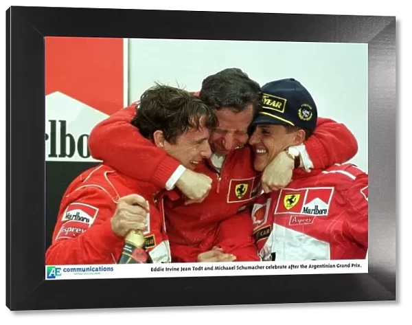 SE 8. Eddie Irvine Jean Todt and Michaael Schumacher celebrate after the