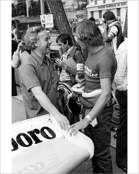 Formula One World Championship: Keith Duckworth Co-founder of Cosworth Engineering, talks with James Hunt McLaren, who retired from the race