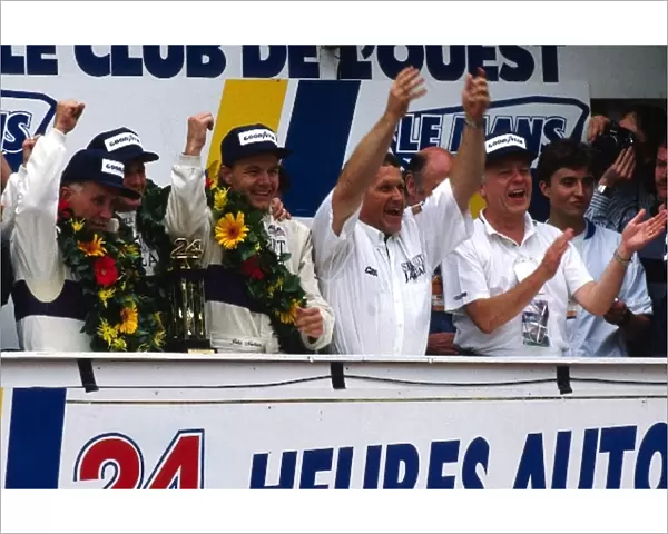 Le Mans 24 Hour Race: The Silk Cut Jaguar team celebrate their 1-2 finish on the podium: Price Cobb winner; Eliseo Salazar winner; John Nielsen