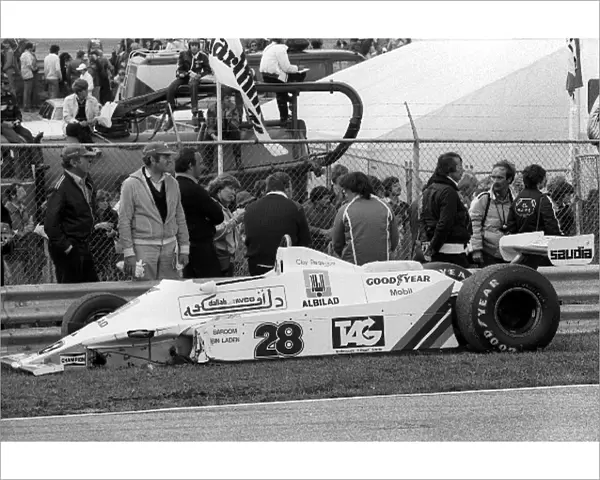 Formula One World Championship: The damaged Williams FW07 of Clay Regazzoni sits by the side of the circuit after a start line crash