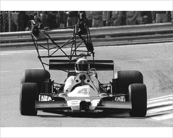 Formula One World Championship: Former World Champion Jackie Stewart drives a modified Tyrrell 008 with extensive rigging for onboard camera