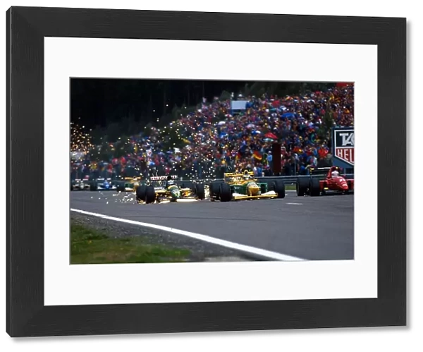 Formula One World Championship: L to R: Sixth place finisher Mika Hakkinen Lotus 107 pursues first time race winner Michael Schumacher Benetton B192