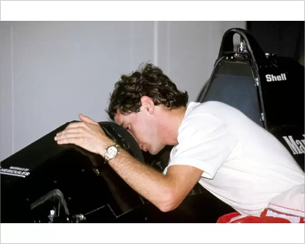 Formula One World Championship: Ayrton Senna peers into the cockpit of his McLaren MP4  /  5