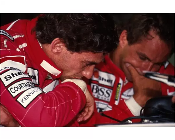 Formula One World Championship: Ayrton Senna McLaren and team mate Gerhard Berger discuss tactics