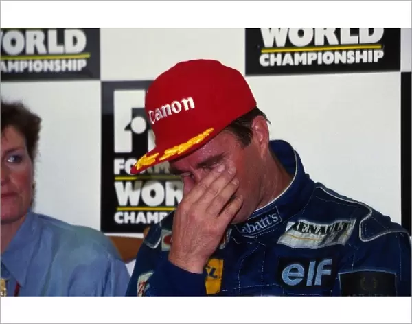 Formula One World Championship: World Champion Nigel Mansell shows the emotion after claiming the title