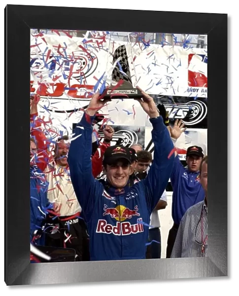2002 IRL Michigan, 28 July, 2002 Tomas Scheckter holds trophy after his win at