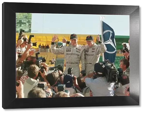 SE 11. David Couthatrd and Mika Hakkinen celebrate their 1-2 in the Australian GP