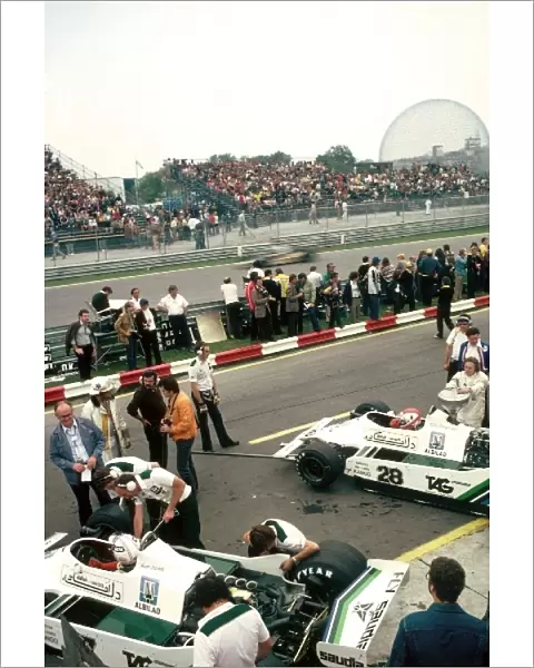 Formula One World Championship: The Williams FW07s of: race winner Alan Jones and third placed team mate Clay Regazzoni in the pits