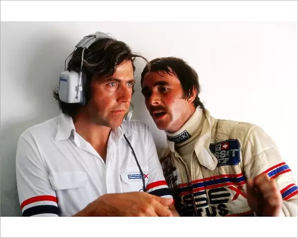 Formula One World Championship: Nigel Mansell, Lotus, right, chats to Peter Wright, Lotus engineer