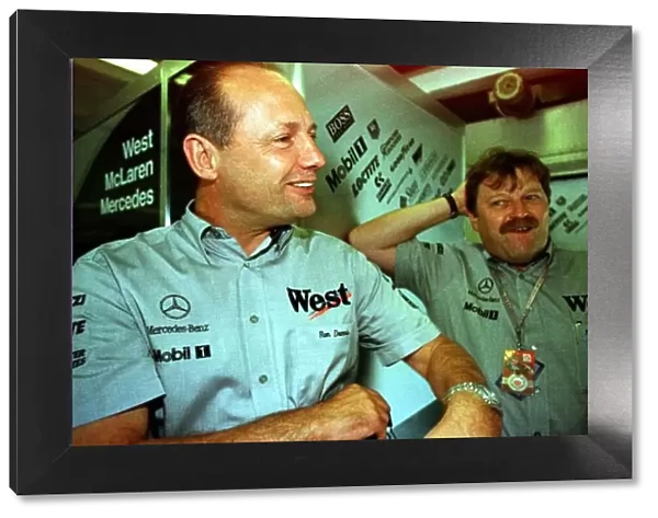 1997 HUNGARIAN GP. Ron Dennis and Norbert Haug enjoy David Coulthards encouraging
